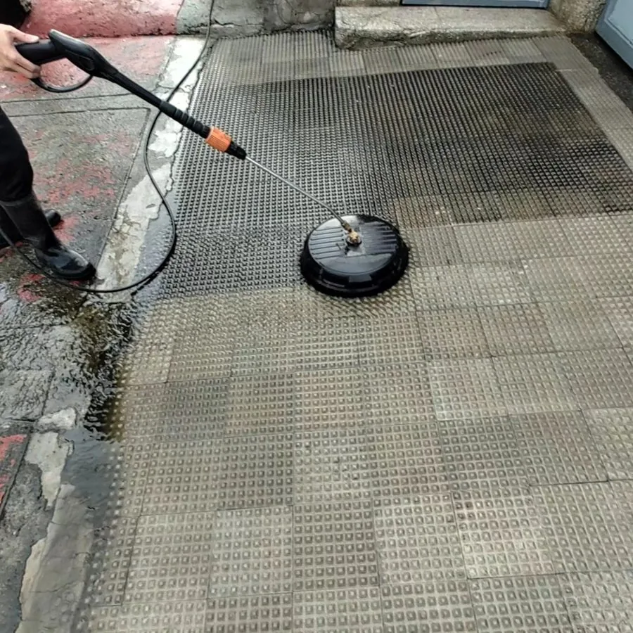 Surface cleaner washing a paved entrance